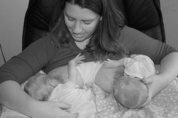 mom nursing twins image